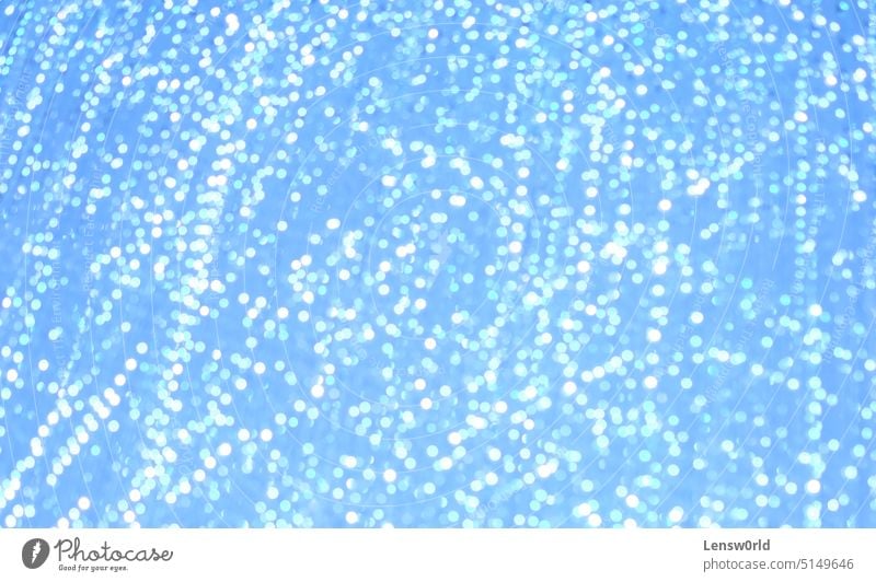 Blurred out lights creating an abstract pattern backdrop background blue blurred lights bokeh bokeh background bright glitter shine shiny texture white
