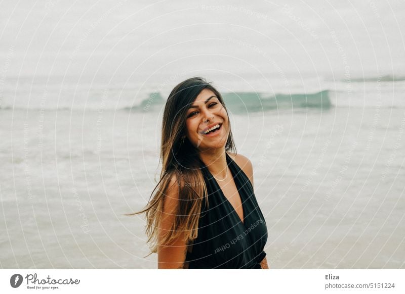 Laughing woman in black swimsuit on beach Woman Beach Swimsuit Laughter Joy Good mood omitted Happiness Joie de vivre (Vitality) Ocean Positive Human being