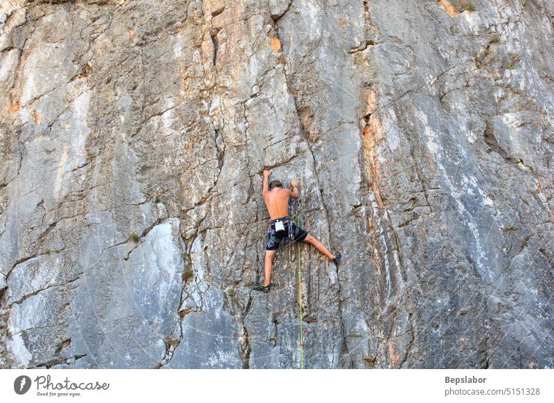 Climber on Sistiana rock, Trieste Young sistiana chord clamber cliff climb climbing equipment hanging kink rig rope scalar trieste wall adventure athlete body