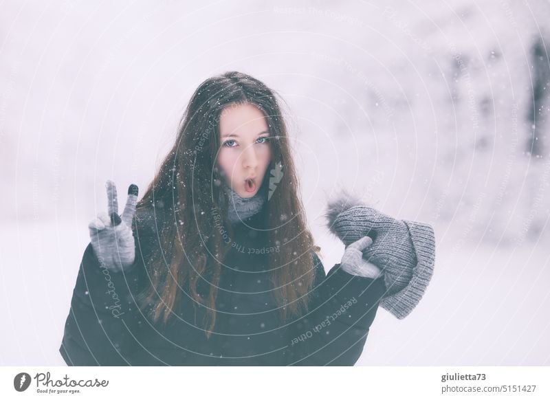 Winter portrait of cool teenage girl showing Victory sign/ sign of victory Girl Young woman Youth (Young adults) youthful Puberty Crazy teenager Fish