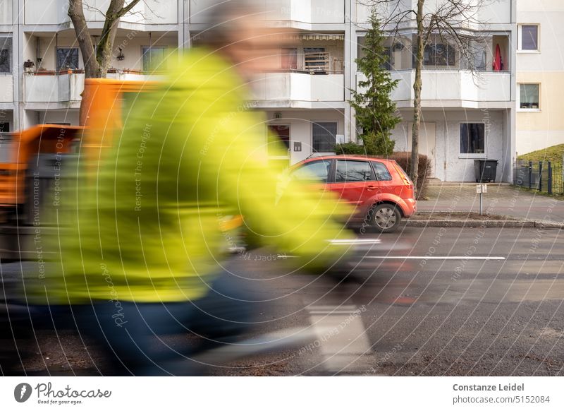 Cyclist with green jacket in motion. cyclists Cycling Bicycle Road traffic Luminous green signal green Fluorescent color luminous colours car traffic