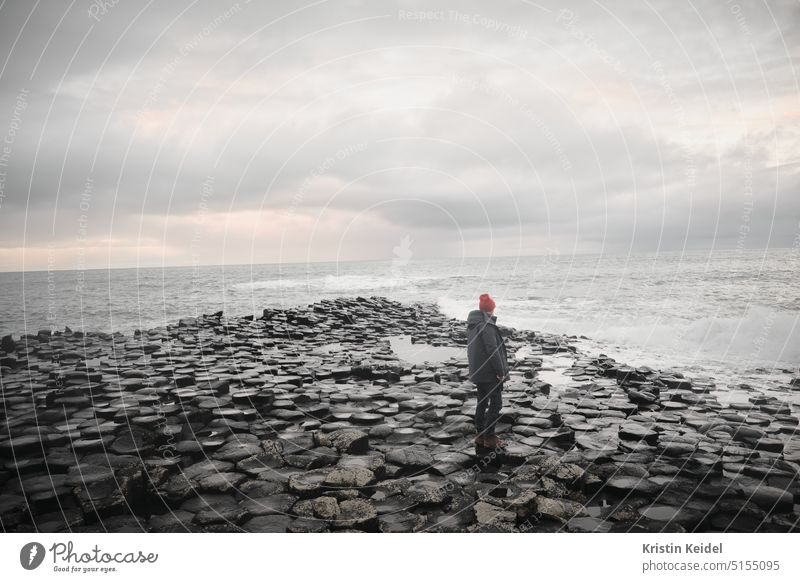 Lonely coast Man Meditative Ireland Giant Causeway vacation curt stormy stormy times Nature Ocean Water Landscape Rock Sky Cliff Waves Vacation & Travel