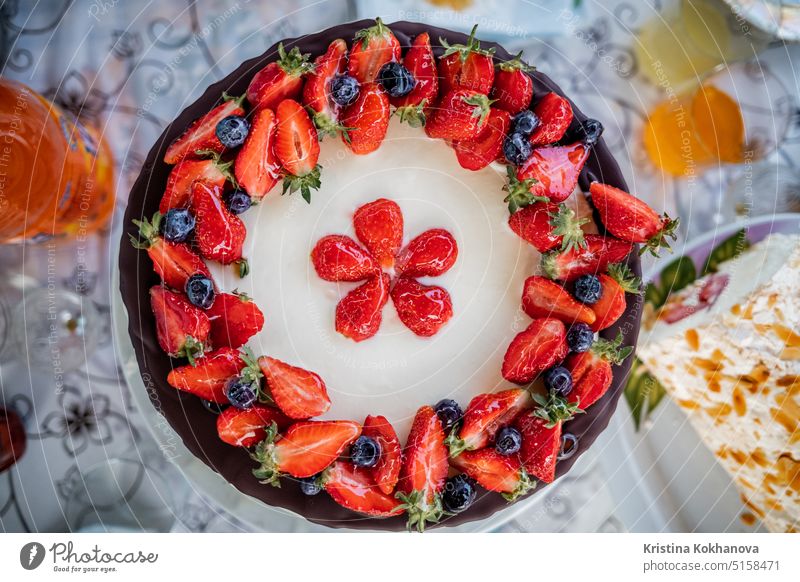 Amazing beautiful homemade decorated strawberry Fraisier cake. Tasty, fresh appetizing background baked bakery berries cheese cheesecake closeup cream crust