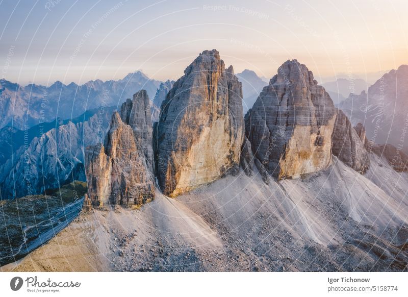 Aerial view to Tre Cime di Lavaredo in Dolomites, Italy aerial dolomites italy cime sunset lavaredo tre sky park outdoor nature mountain landscape hiking europe