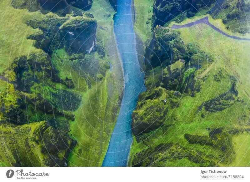 Aerial view of famous and unique Fjadrargljufur valley in Iceland on a rainy day in Iceland. Mossy cliffs and mountain river. Travel tourism destination iceland