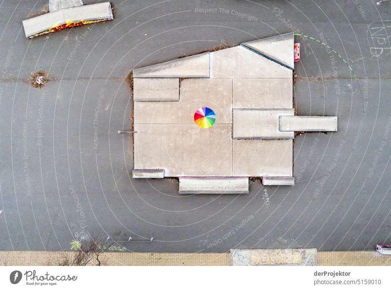 Aerial view of skater facility with rainbow colored umbrella Sports Aerial photograph Deserted Copy Space middle Structures and shapes Copy Space top Pattern