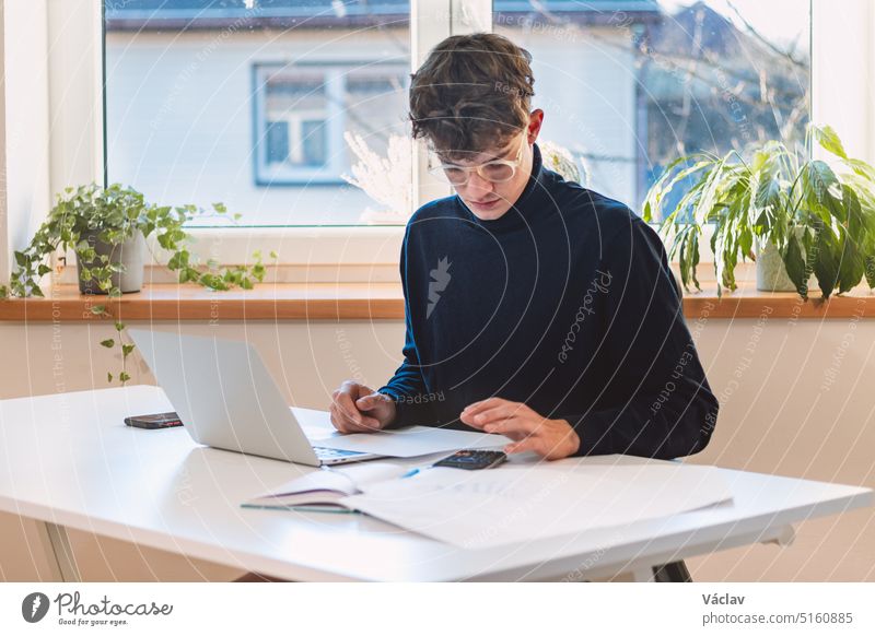 Brown-haired entrepreneur comes to the company with a new working concept, which he calculates with other technological accessories and writes his notes in his laptop