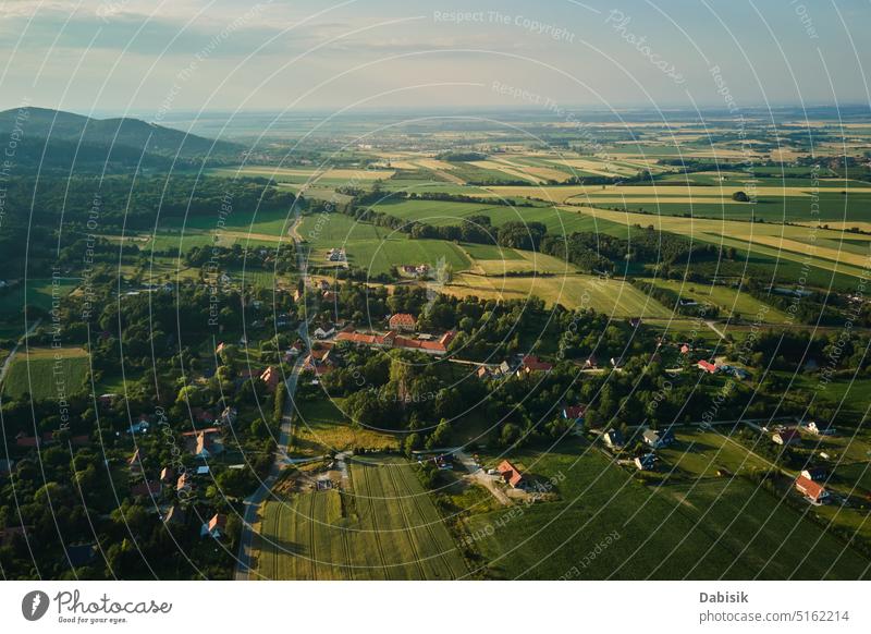 Aerial view of countryside area with village and mountains overhead poland landscape rural aerial valley agriculture environment field forest green hill nature