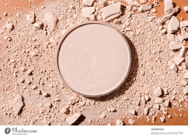 Crushed face powder on brown background crushed powder makeup cosmetic cheek pigment coverage finish skin beauty pressed powder beige foundation