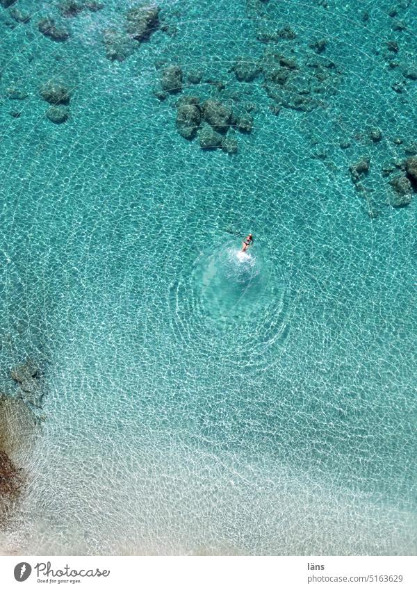 Woman swimming in sea Floating Ocean vacation Water Summer Relaxation Nature Naiad Freedom Mediterranean sea Crete UAV view Turquoise Bird's-eye view