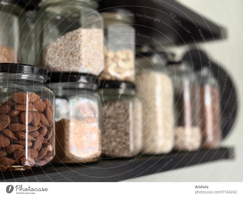 filled storage jars on the shelf Supply receptacle Kitchen Shelves Breakfast almond Cereal Ceralia superfood Sustainability unpacked organic eco Load Shopping