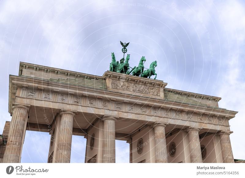 Historic city gate Brandenburg Gate in Berlin, Germany Architecture Attraction Building Building exterior capital Carriage City Classical Clouds cloud landscape