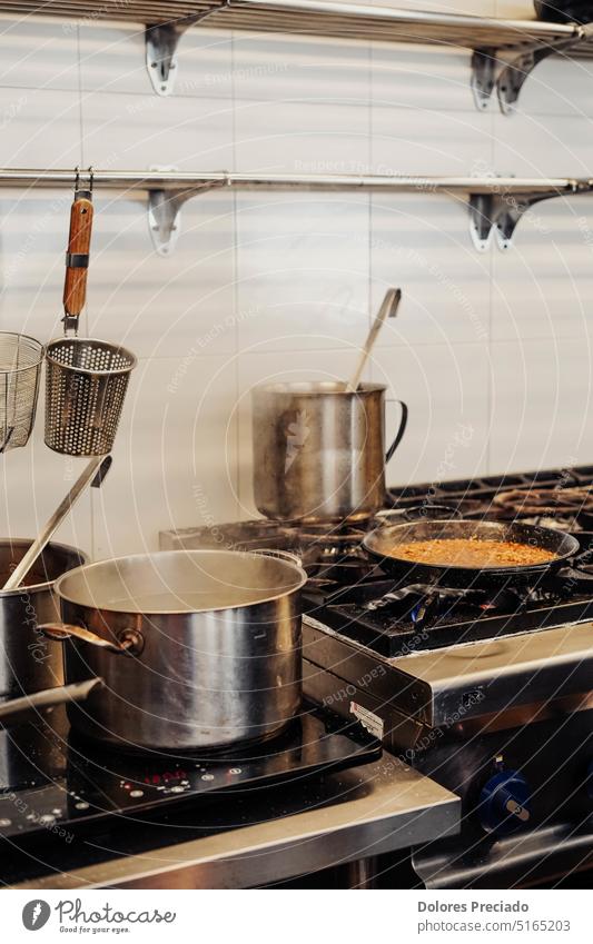 Image of a professional kitchen preparing a paella background beautiful breakfast brown casserole catering closeup coffee cook cooker cooking crock decor design