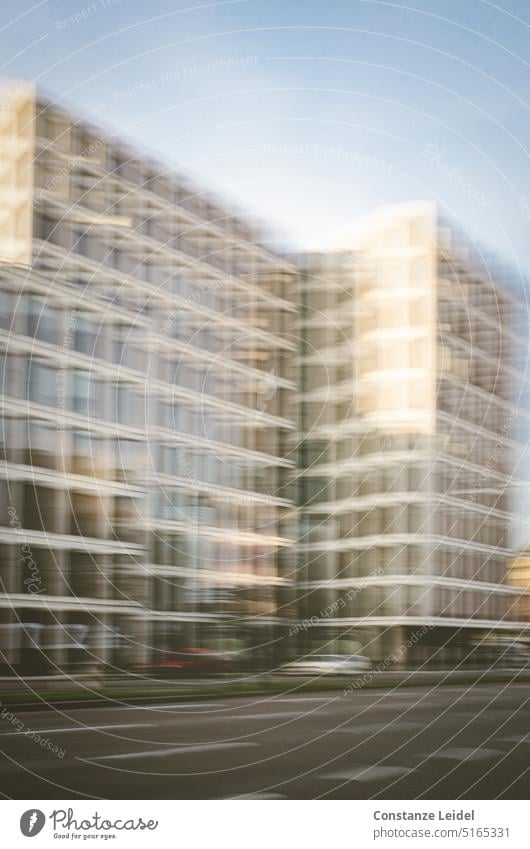 High-rise facade with glass front in ICM Window Glazed facade motion blur City dwell blurred abstract photography Unclear Calm hazy ICM technology vibrating