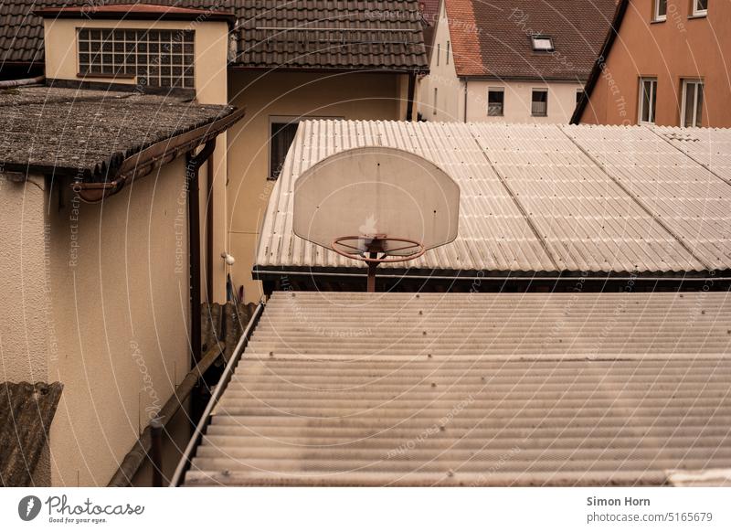 Basketball hoop between corrugated sheets Roofscape Leisure and hobbies roofs Waves relic short of space areas Construction Sports then phenomenal