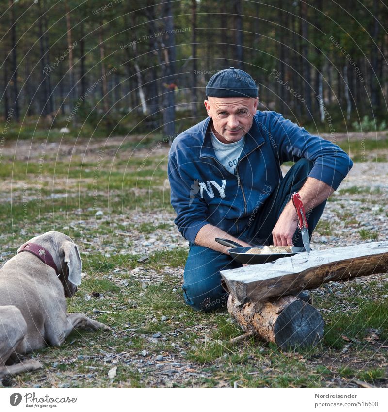 Man and dog cooking on a camping site Nutrition Dinner Picnic Organic produce Pan Lifestyle Well-being Contentment Vacation & Travel Adventure Camping