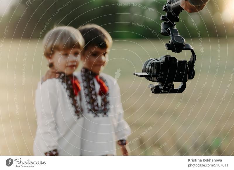 Video camera on stabilizer.Man operator working with kids.Professional equipment cameraman film media professional television video videographer broadcast