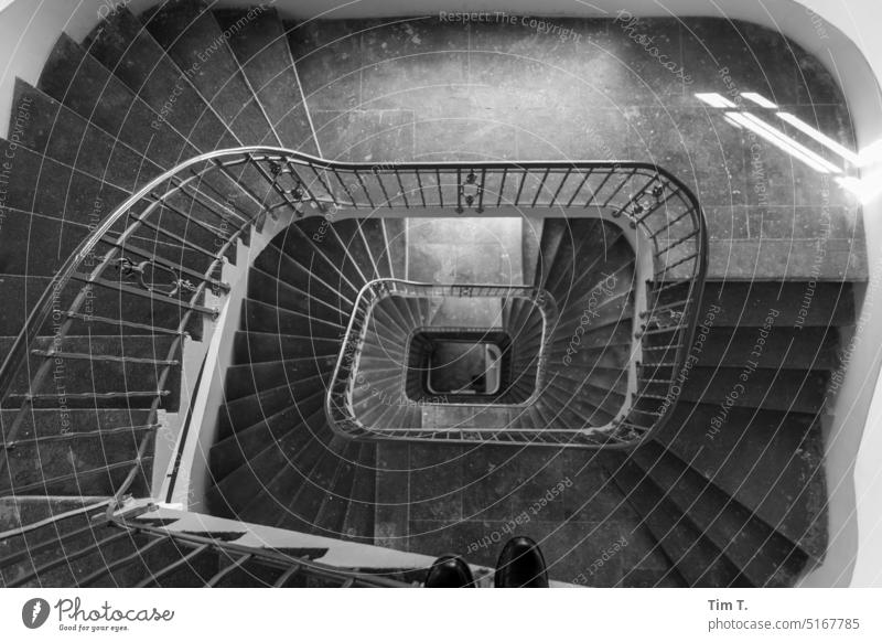 spiral staircase Downward Winding staircase b/w Berlin Stairs Black & white photo Interior shot Town Day Deserted Architecture Manmade structures bnw Building