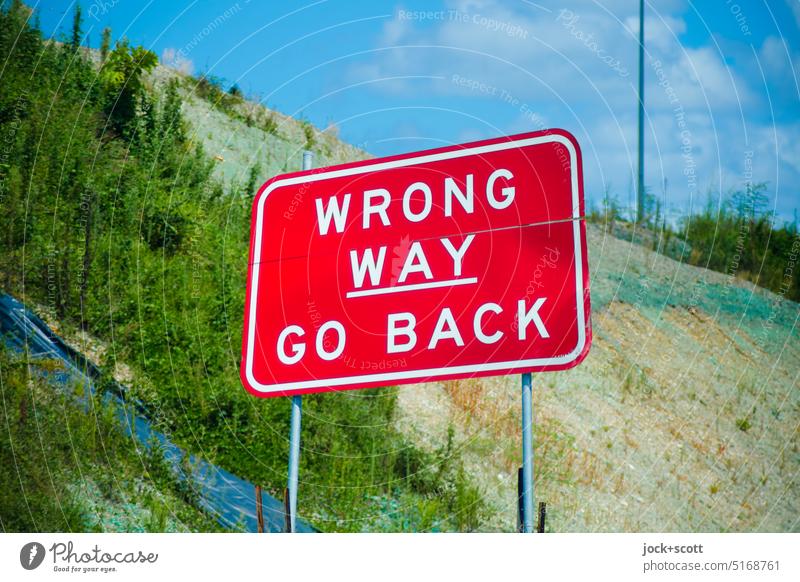 WRONG WAY GO BACK Road sign Traffic infrastructure Lanes & trails False invitation Backward Australia English Word Red Change New building Pacific Highway