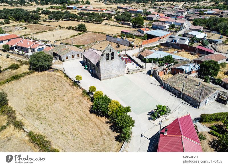 Small town of Castilla. Air view of the churh and the square aerial aerial city aerial view air ancient architecture building castilla center church countryside