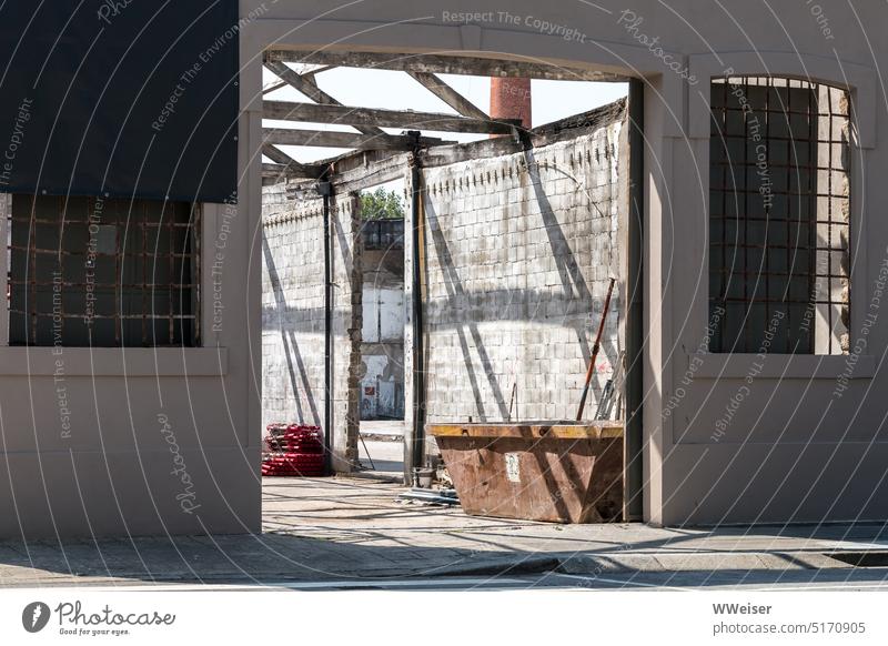 Insight into a construction site illuminated by the sun, where work is paused Construction site Build construction works stones Concrete Exterior shot Tool