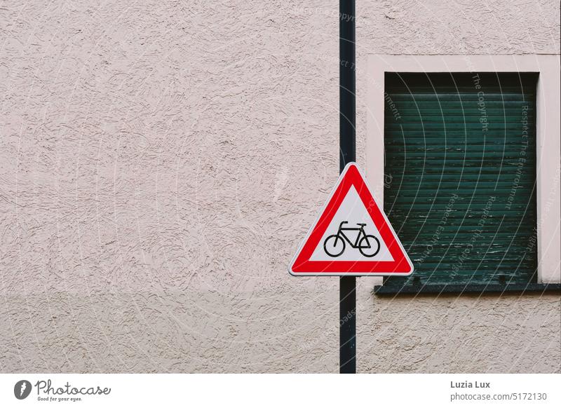 Road sign "Cyclists cross" in front of a lowered green window shutter Triangle Red cyclists Cross cyclists Street Facade urban Shutter Load Green Old Town