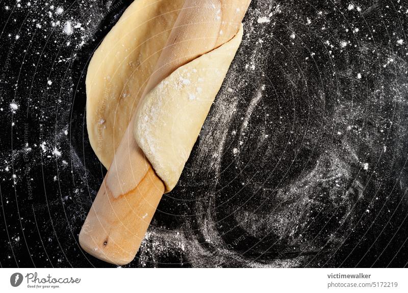 Dough and rolling pin on floured surface dough food pastry bakery puff pastry white studio shot homemade cooking kitchen utensil baked top view indoor