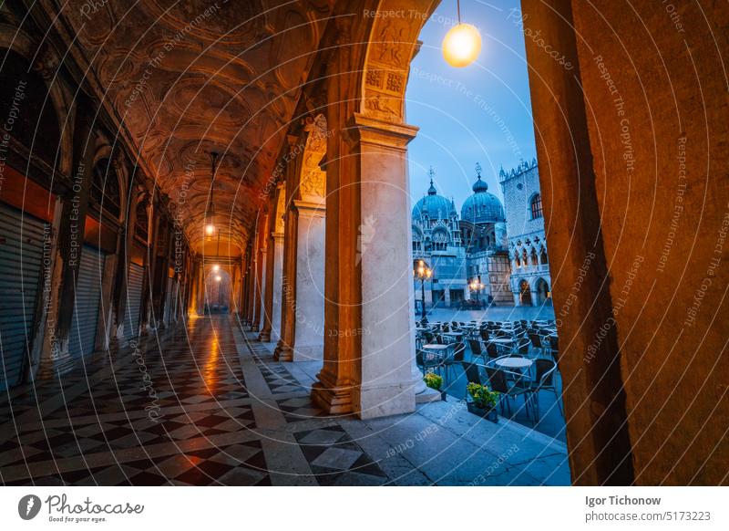 Evening view of Basilica di San Marco and Campanile through the street arch hallway on San Marco in Venice, Italy. Cityscape of Venice at dawn, blue hour italy