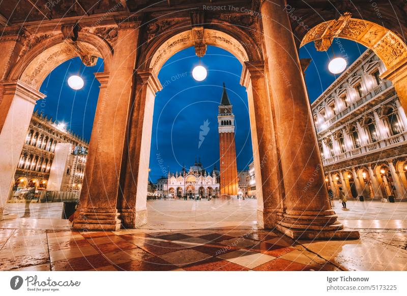 Venice, Italy. Scenic view of Piazza San Marco framed in architectural arches after dusk, blue hour italy venice square san marco italian landmark architecture