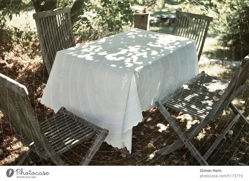 Garden table Summer Table tablecloth Shadow idyllically Peaceful Puristic Warmth rest Eating Meeting point Relaxation Break Sit Calm Bench Exterior shot Green