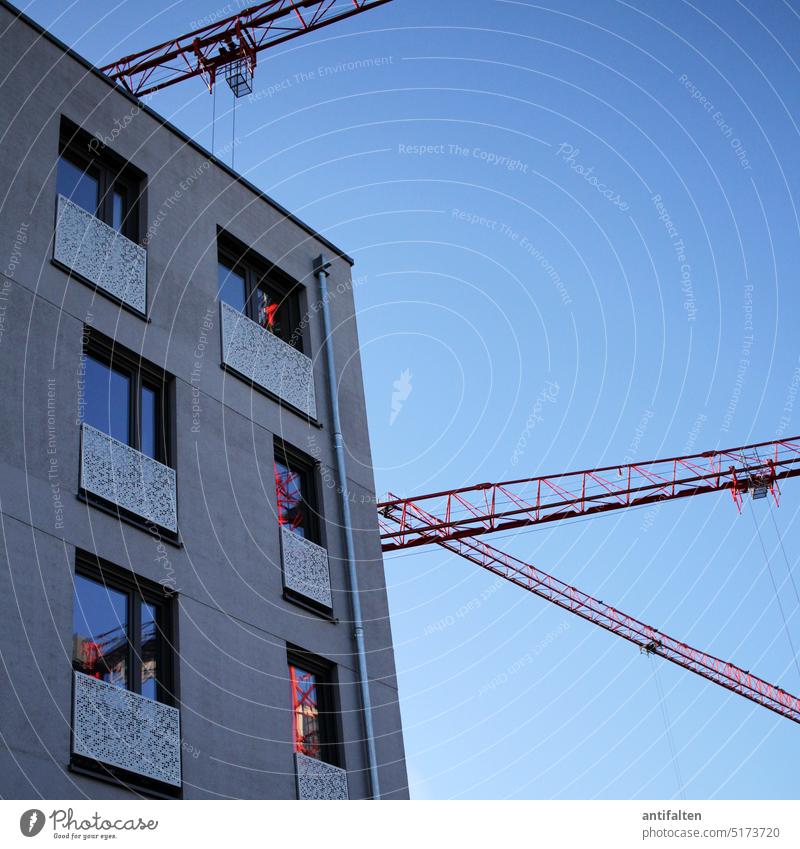 cranes & windows Lift Construction site construction site vehicle Sky Industry Crane Blue Tall Work and employment Build Workplace Technology Exterior shot