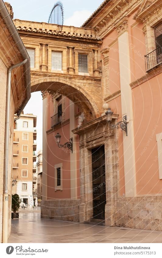Arch of cathedral in Valencia, Spain. Historic buildings and street. arch landmark city spain heritage famous template basilica history exterior decorative town