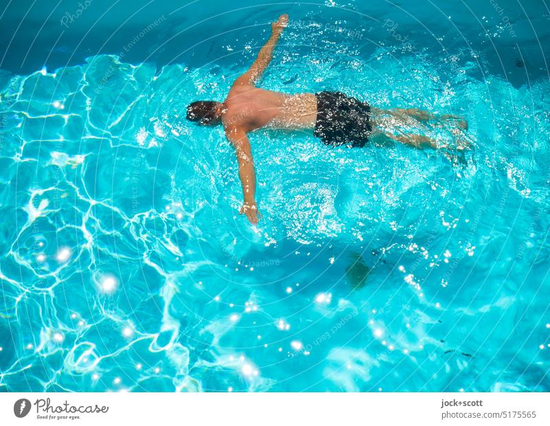 Floating and light floating in the swimming pool Man Swimming pool Swimming & Bathing Summer Blue Vacation & Travel Summer vacation Relaxation