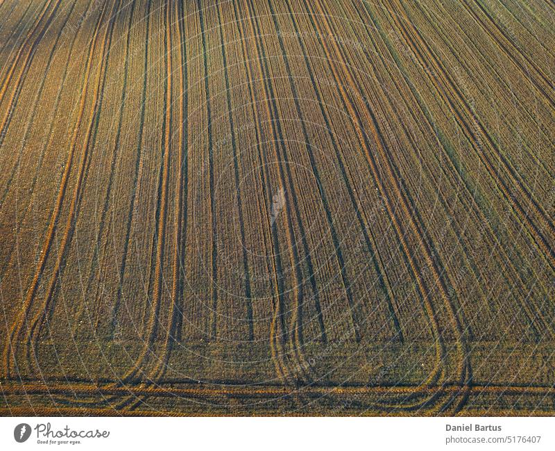 Frozen farmland in the morning during sunrise and the sun's rays falling on it abstract aerial aerial landscape agricultural agriculture agriculture background