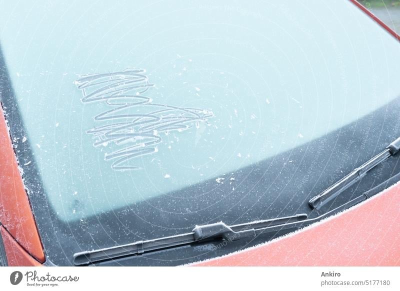 Red car with a frozen window frost vehicle cold winter snow transportation climate weather ice auto season automobile windscreen windshield driving outdoor