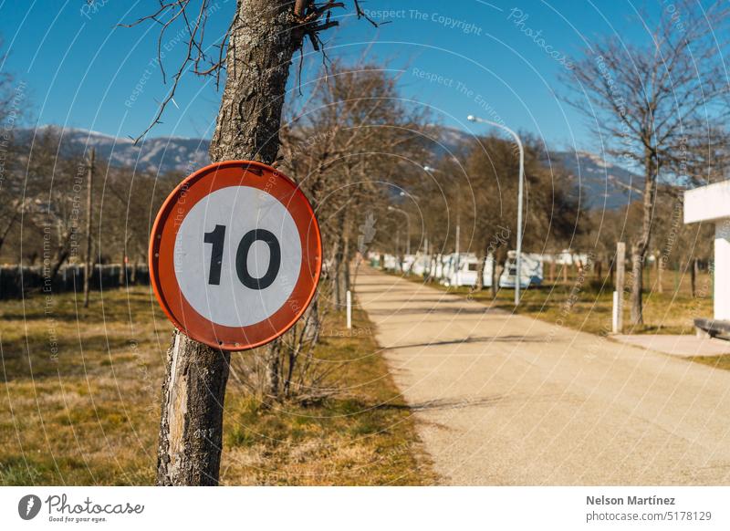 Road sign 10 km/h in a rural area speed limit caution regulation start limited driving countryside signs blue roadsign sky traffic village street sign rule