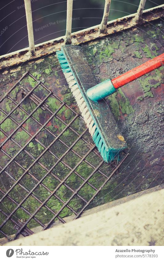 Old dirty broom with a red handle. aqua aqua menthe art background blue clean cleaning tool clraning colorful conceptual design device domestic equipment fender