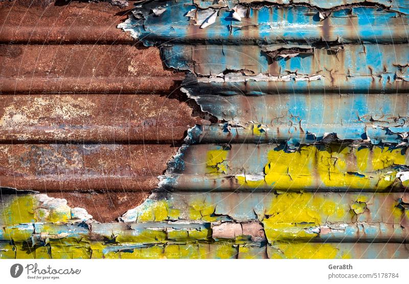 pattern rusty metal surface with remnants of blue and yellow paint paint Ukraine abstract aged backdrop background board burned closeup color ukraine