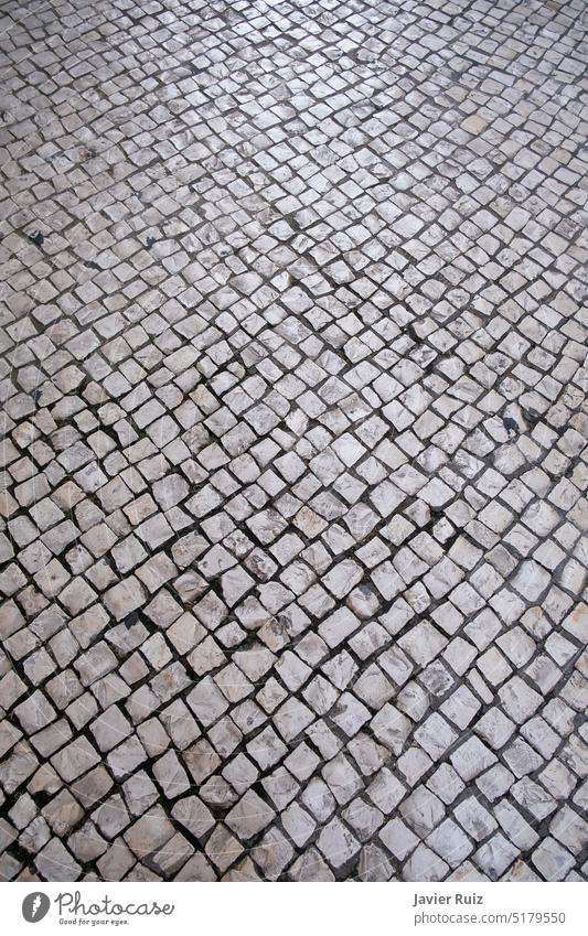 Portuguese roadway or Portuguese cobblestone, paving stone texture, mosaic shaped pavement portuguese paved background street floor bricks pattern portugal