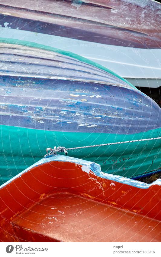Winter break | detail of boats lying ashore Rowboat Vacation & Travel Holiday season End of the season Harbour melancholically Weathered variegated colored Blue