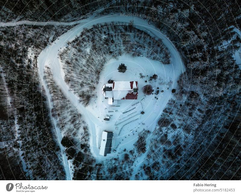 Chapel on snow covered mountain at golden hour at sunrise Mountain Snow Sunrise Landscape Sunlight Sky Exterior shot Winter drone droning UAV view Nature