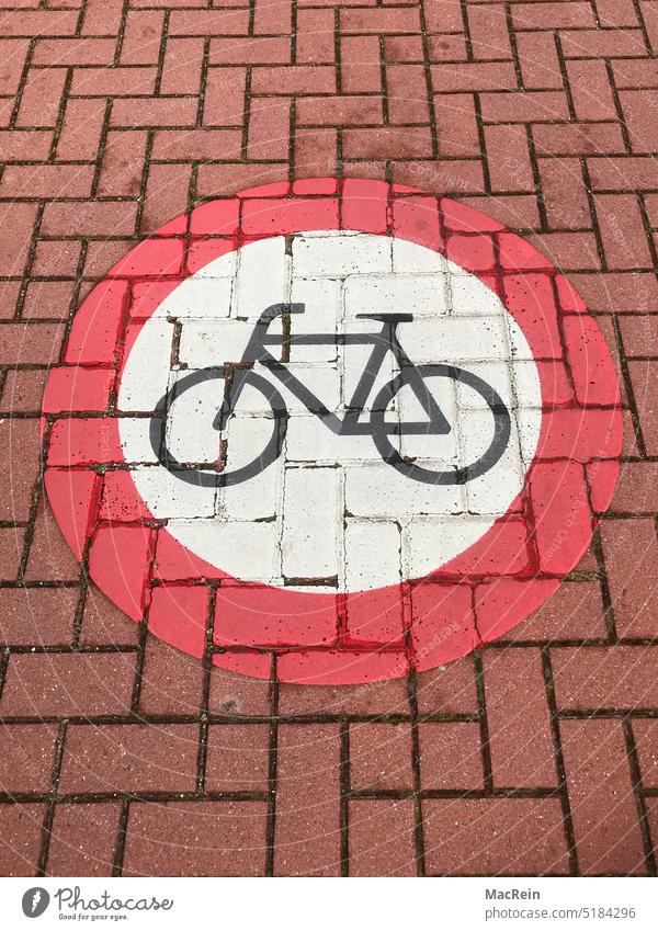 Ban for cyclists Bicycle Prohibition sign Road sign Red Paving stone nobody no man