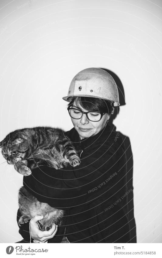 Young worker with cat Cat Work and employment Pet Human being Business Woman Animal Smiling Lifestyle Adults Day labourer b/w B/W Black & white photo B&W