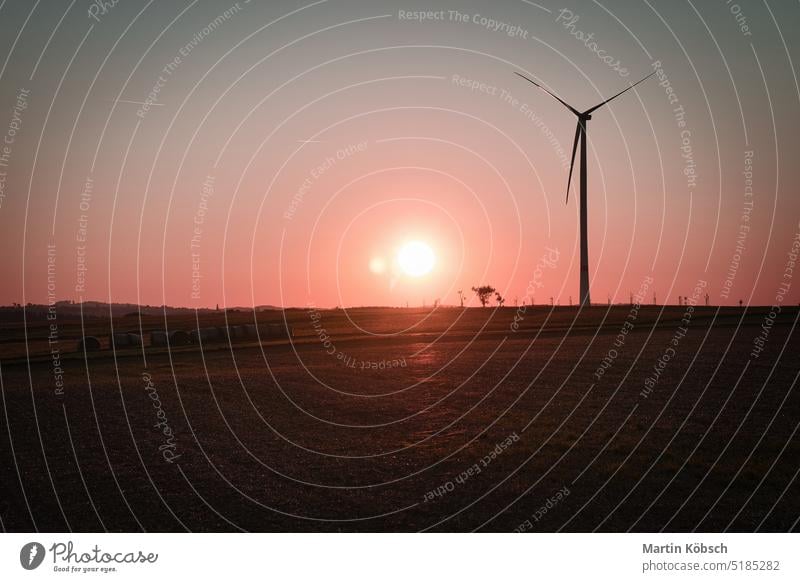 onshore wind turbine on a meadow at sunset. Renewable energy. Clean electricity wind power plant clean energy second change grid supplier power generation