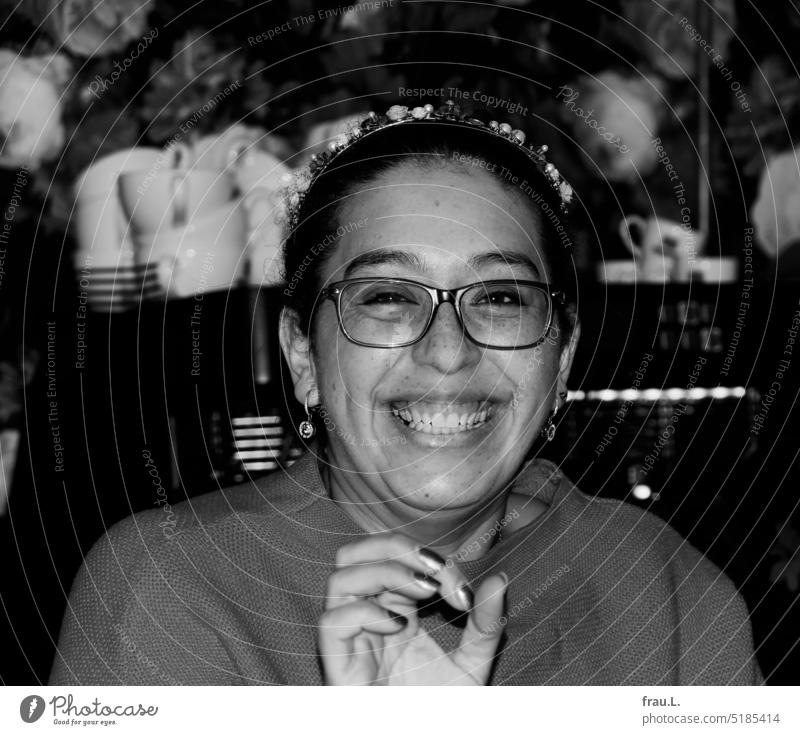 radiant Freckles Eyeglasses Woman Charming Attractive Dark-haired naturally kind Laughter Bakery shop Happiness Congenial Joy Authentic Joie de vivre (Vitality)