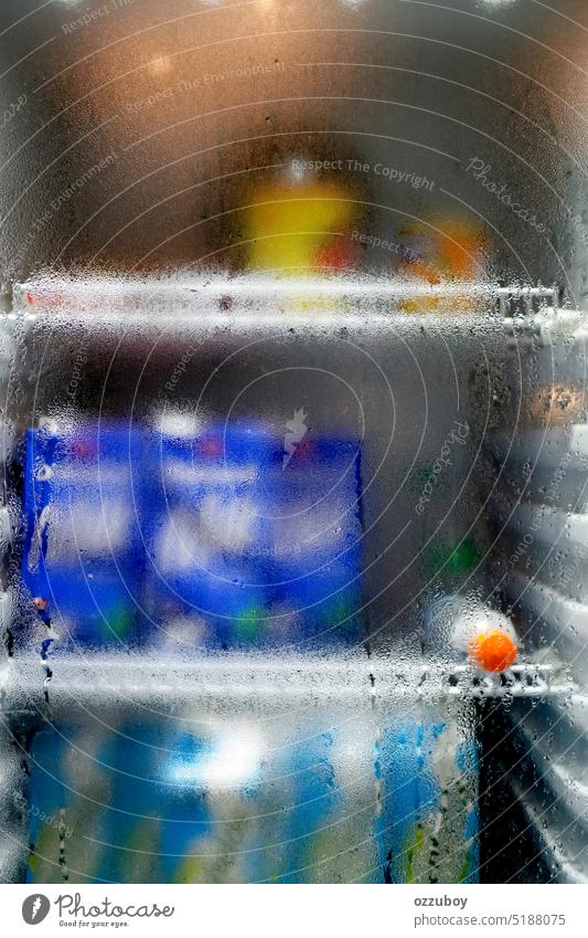 Close-up of water droplets on the glass of the refrigerator. Condensation conditions of the water in the fridge background condensation wet transparent cold