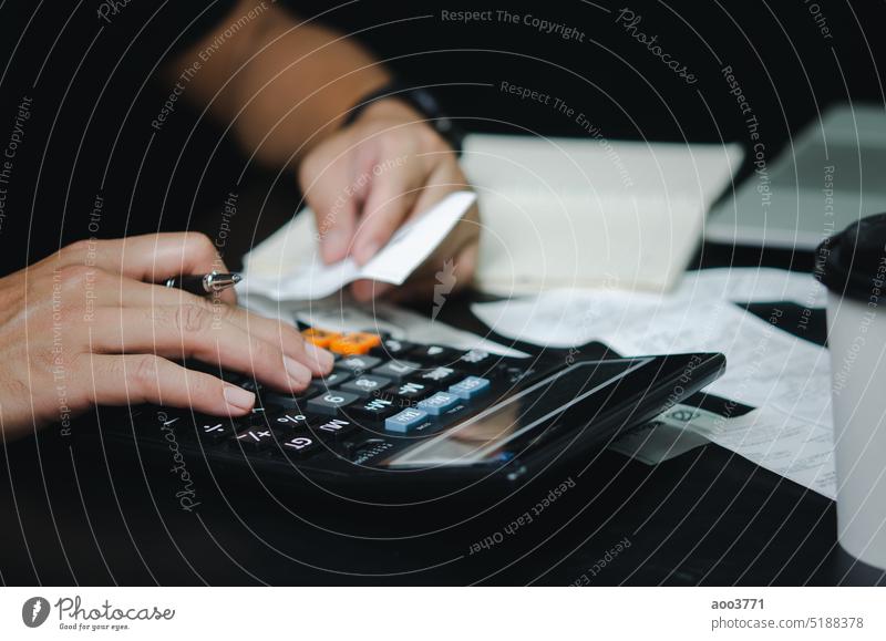 Man hand holding bill and pen with calculator expense or tax receipt. business finance concept. banking invoice paperwork report account payment man budget