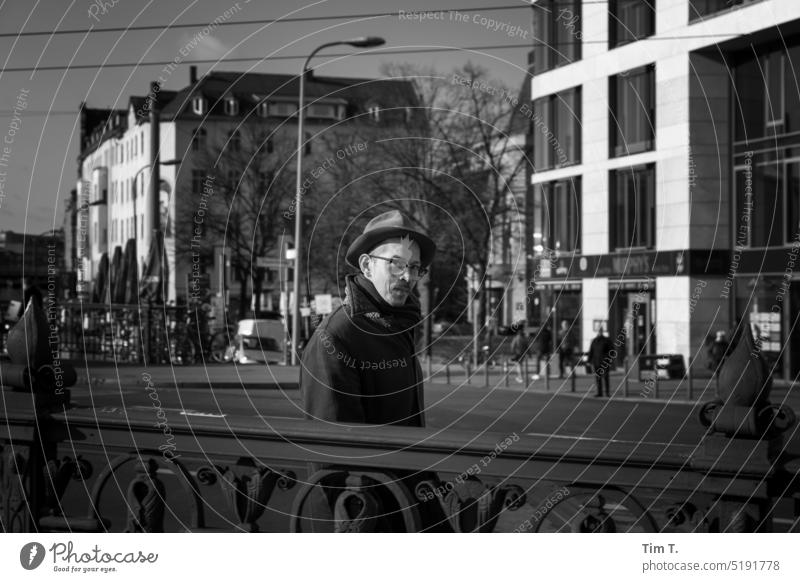 Man with hat and glasses b/w Friedrichstraße Berlin Black & white photo Exterior shot Day Town Capital city Downtown Architecture bnw Downtown Berlin Hat