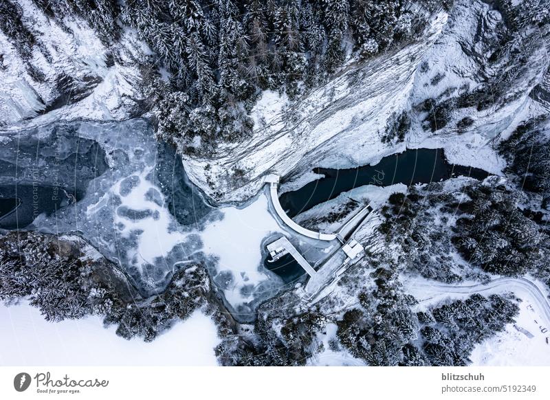 Aerial view of a hydroelectric power plant in winter hydropower stream Energy Reservoir Switzerland Energy industry Mountain Force Water Lake Nature Electricity