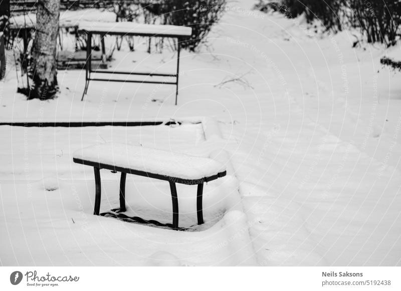 cold place to think and remember cemetery graveyard bench chair snow covered burial ground wintertime Grave Death Grief Transience Sadness Religion and faith